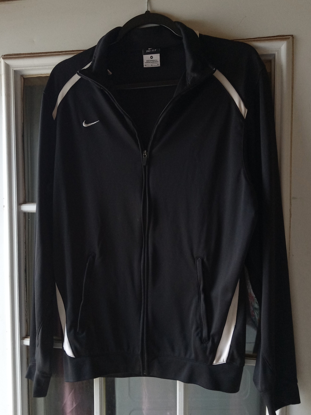 Nike Black Track Jacket with White Accents and Zip Front Pockets